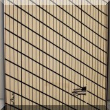 A09. Geometric art photo of a building and flag signed Joe Ofria. 11”w x 14”h - $18 